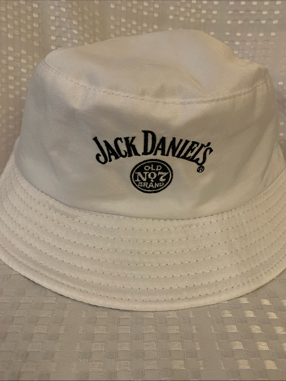 Jack Daniel's white bucket hat reverses to a black bucket hat.